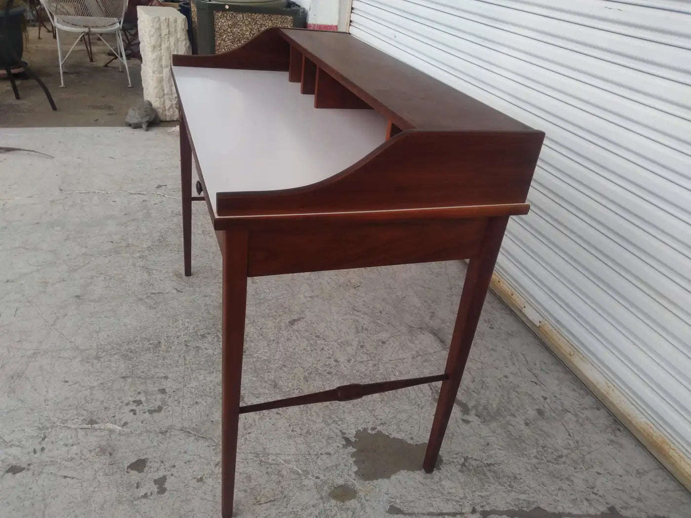 Elegant mid-century desk with white top and storage drawers