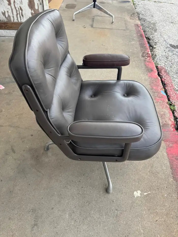 Mid century modern executive chair with black leather upholstery
