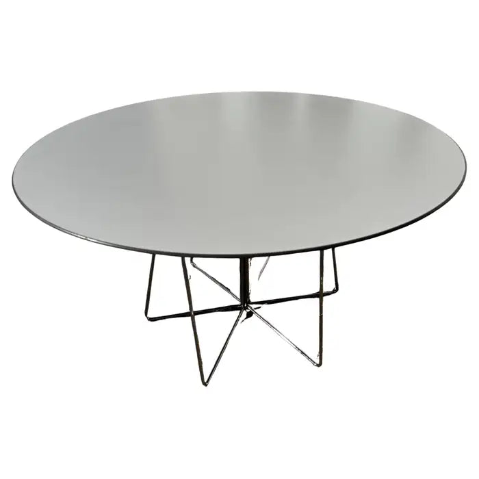 Mid century modern round table featuring wire metal base