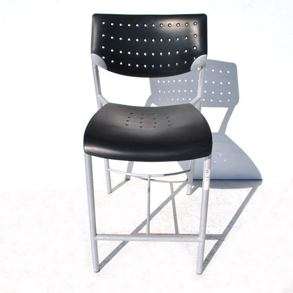 Modern black bar stool perforated seat Tom Deacon design