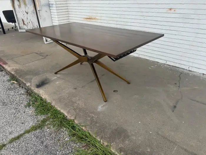 Architectural spider base dining table