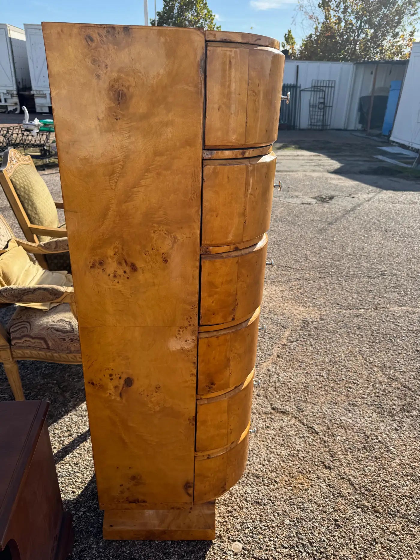 High end burl wood dresser with rich grain patterns and polished finish for home decor.