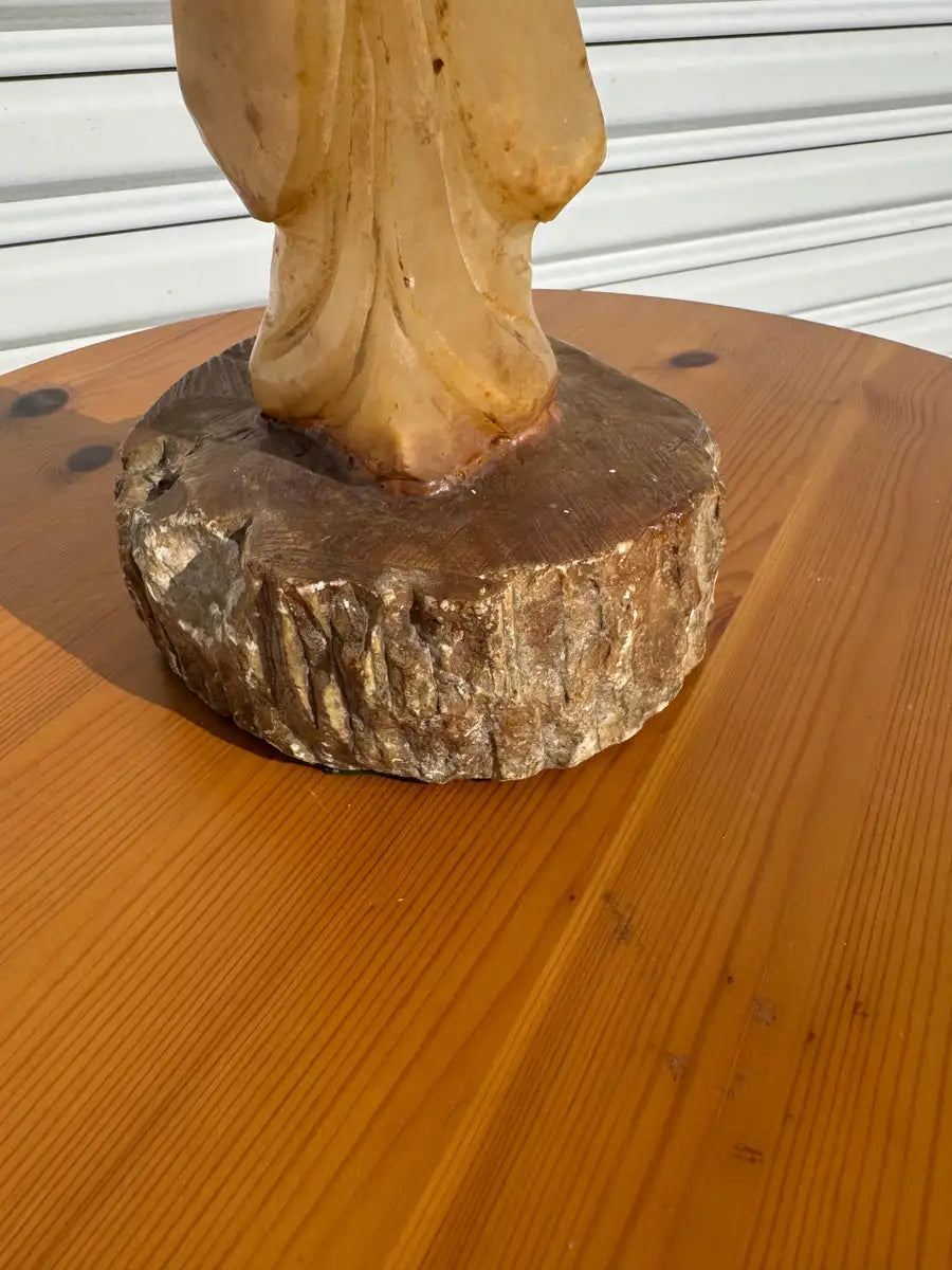 Carved monk statue in natural stone finish