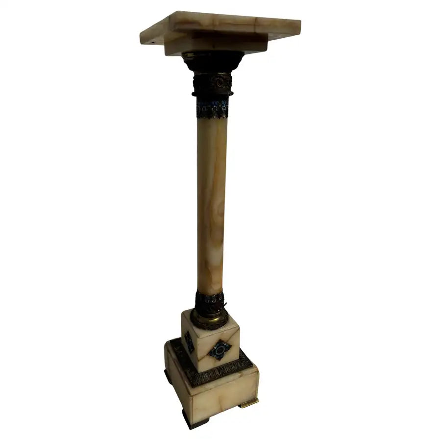onyx stone pedestal with bronze accents and enamel detailing