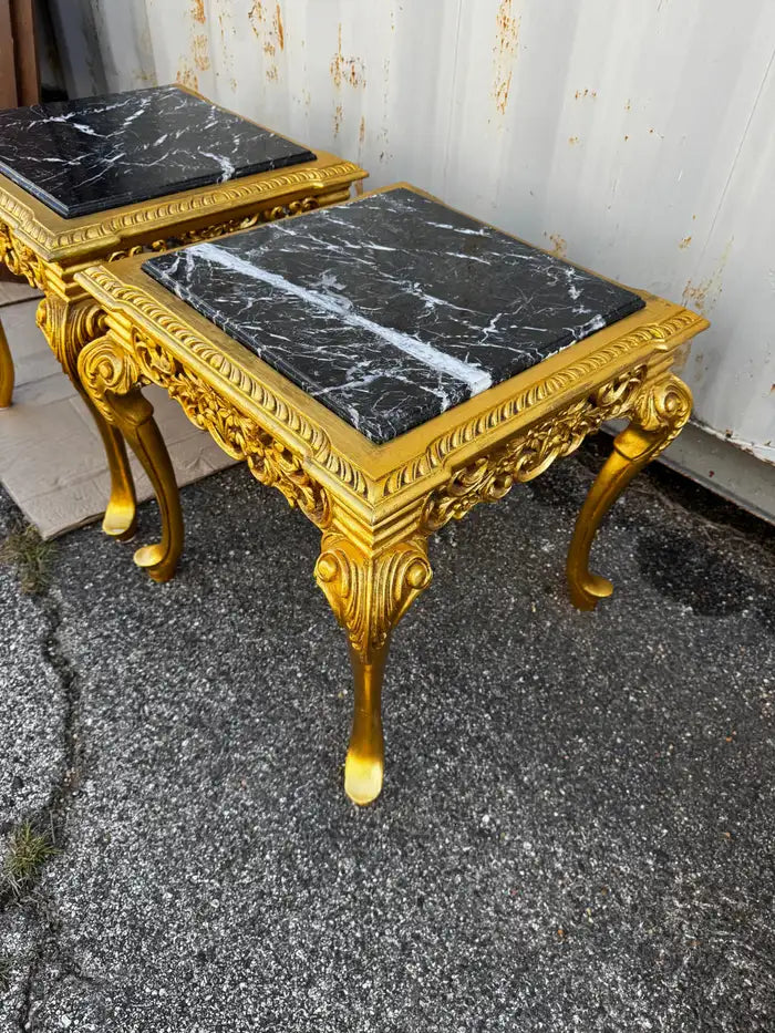 Decorative side tables with marble tops and gilded wood frames