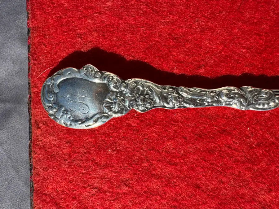 engraved silver fork with traditional design