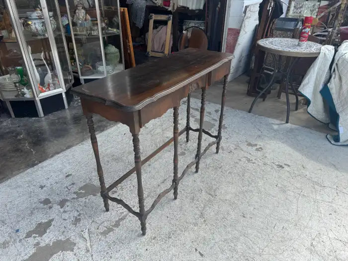Traditional vintage console table with detailed wood craftsmanship
