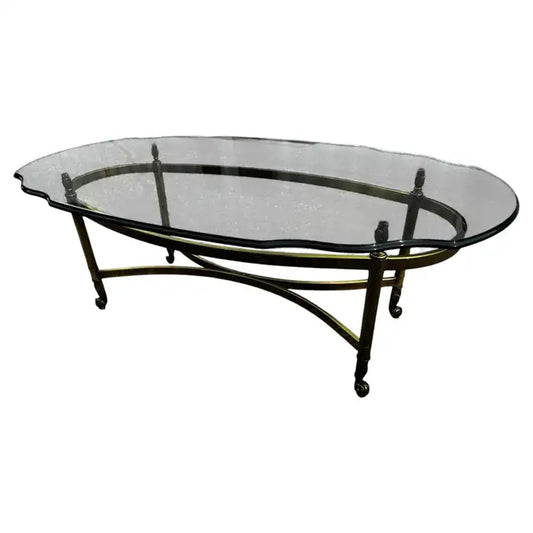 Oval brass coffee table with beveled glass top