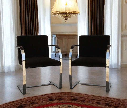 Pair of BRNO stainless steel flat bar arm chairs