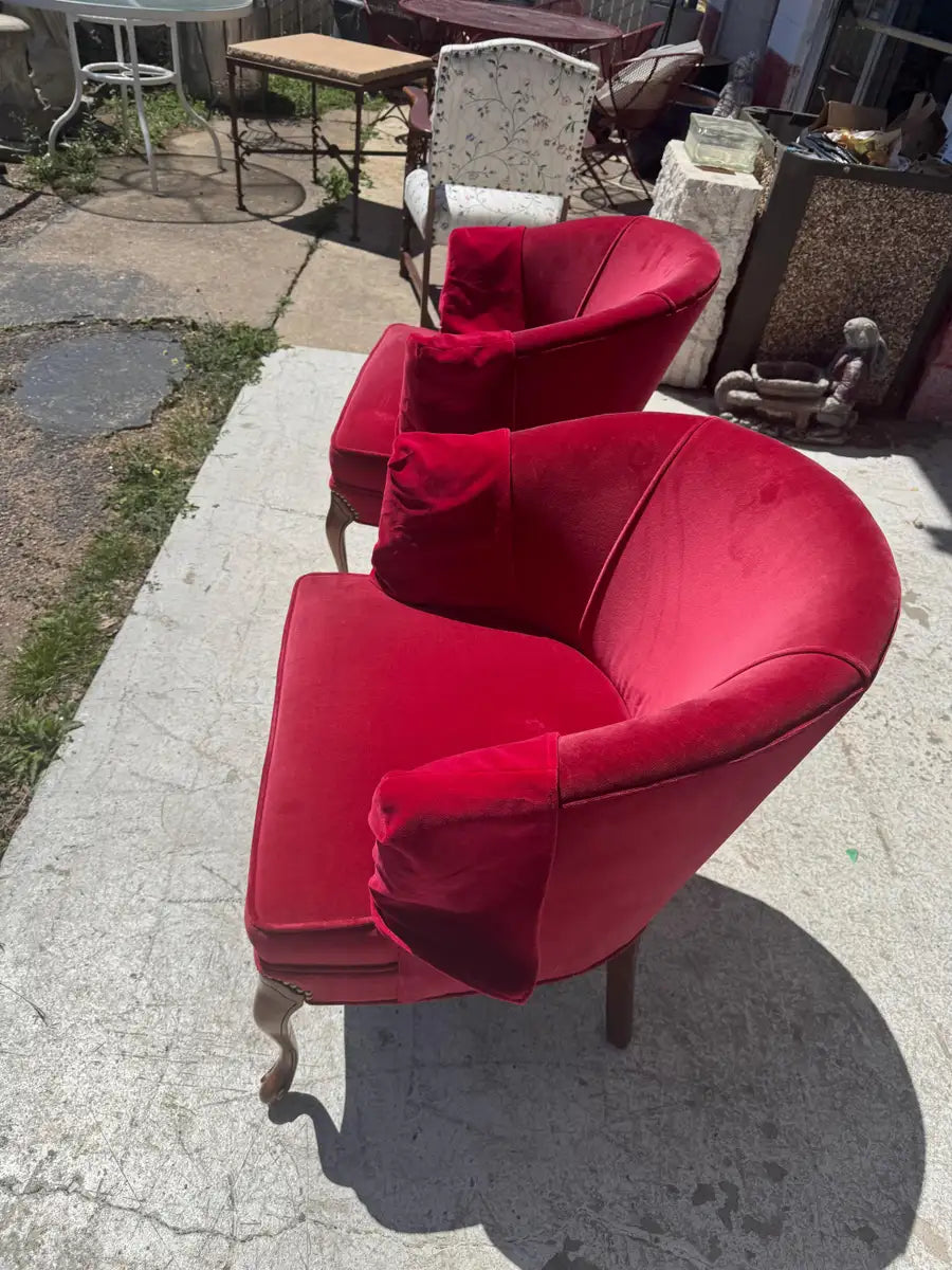 red velvet barrel chairs with rounded backrest