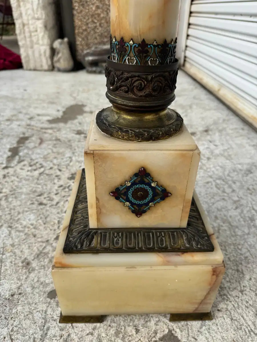 onyx marble column with bronze ornamental accents
