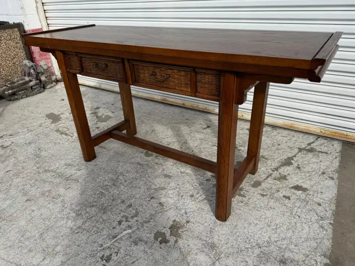 Modern oak console table with woven rattan detail