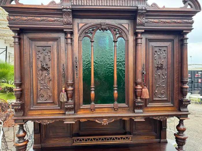 antique wood sideboard with intricate relief carvings