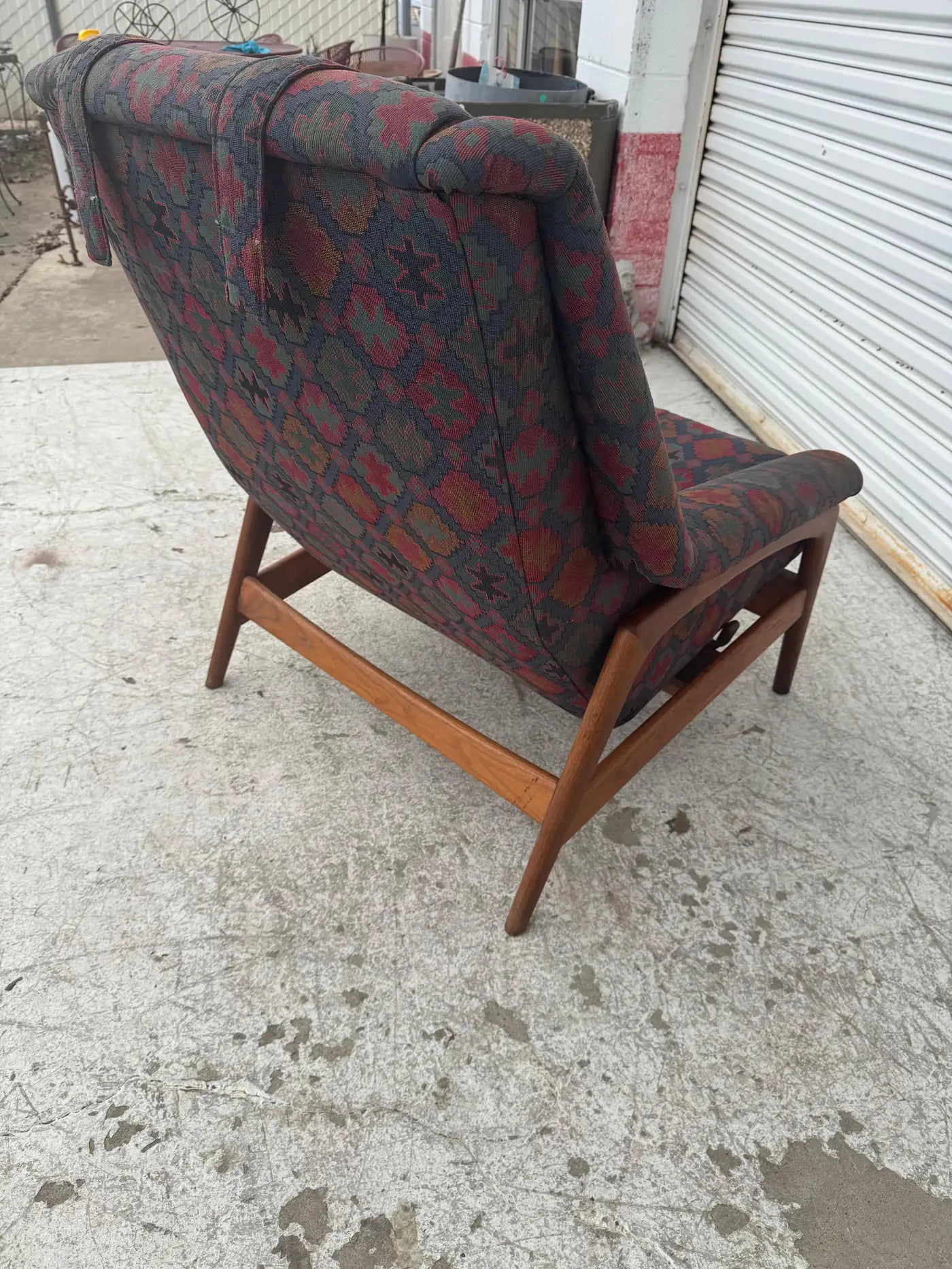 Vintage DUX recliner with wooden base and plush cushions, ideal for mid century modern interior seating arrangements.