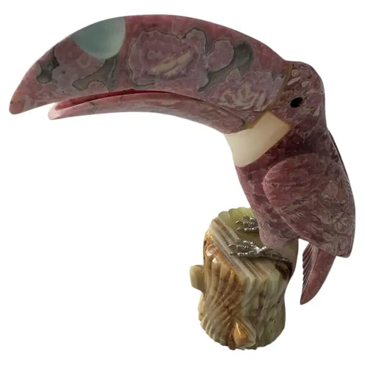 Rose quartz toucan sculpture on onyx tree stump base