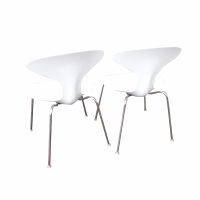 Sleek sculptural side chairs—set of twelve stacked