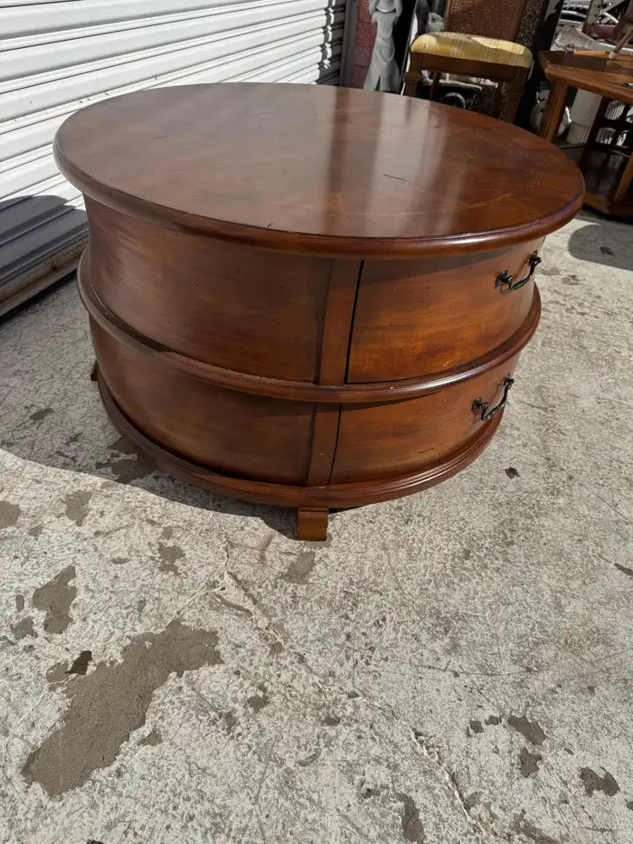 Round wooden coffee table with polished finish