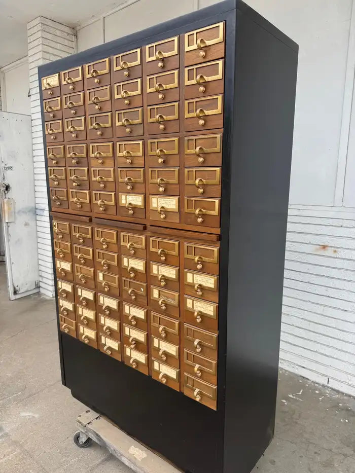 Rustic wooden apothecary cabinet with label pulls