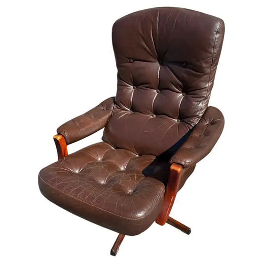 Scandinavian leather swivel lounge chair with tufted back