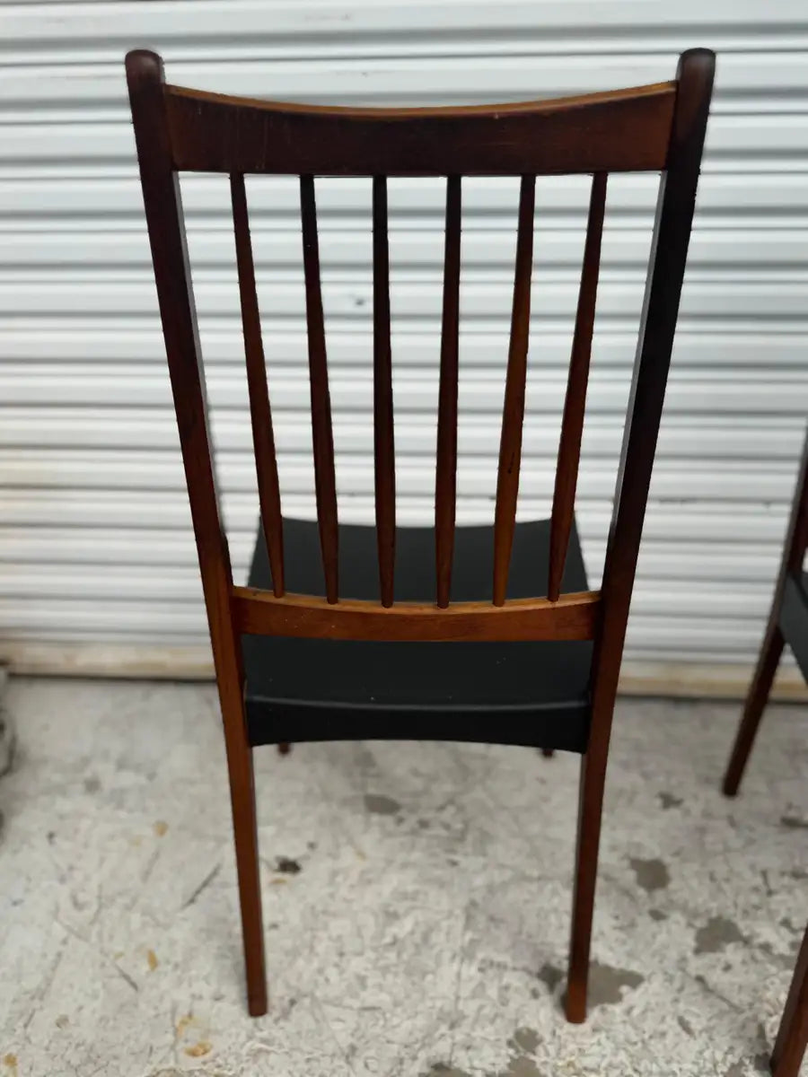 vintage teak dining chairs with natural wood grain texture