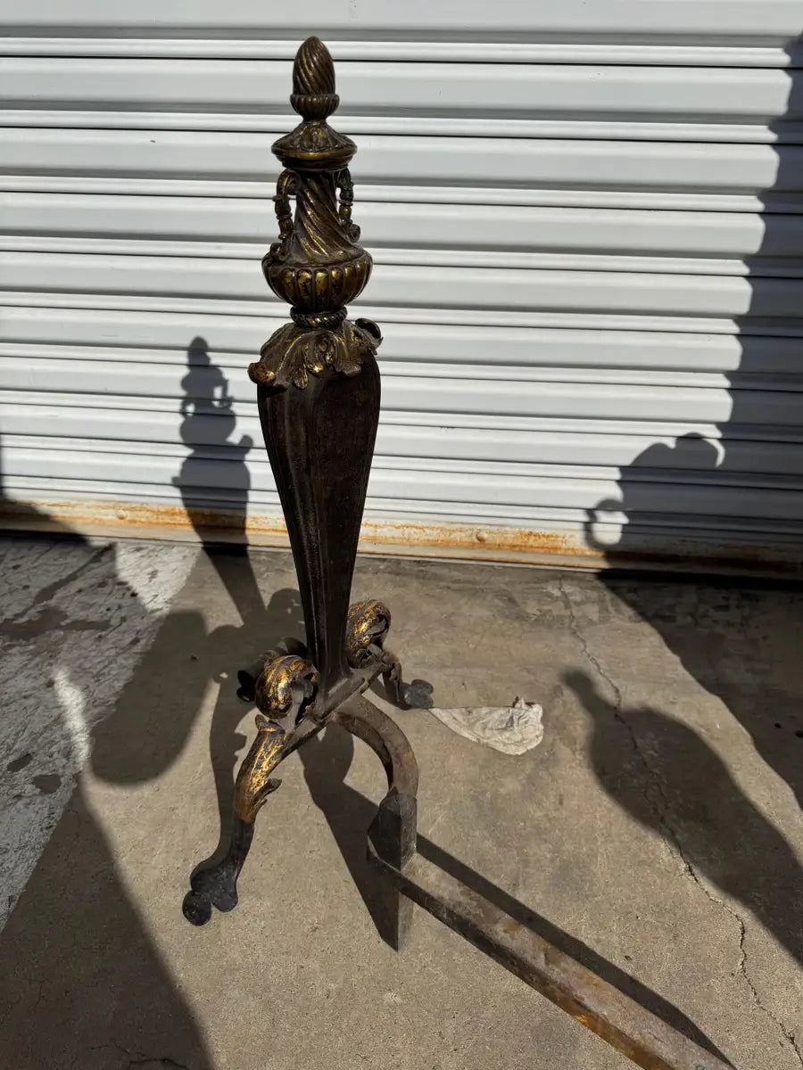 ornamental fireplace andirons with gold tone accents