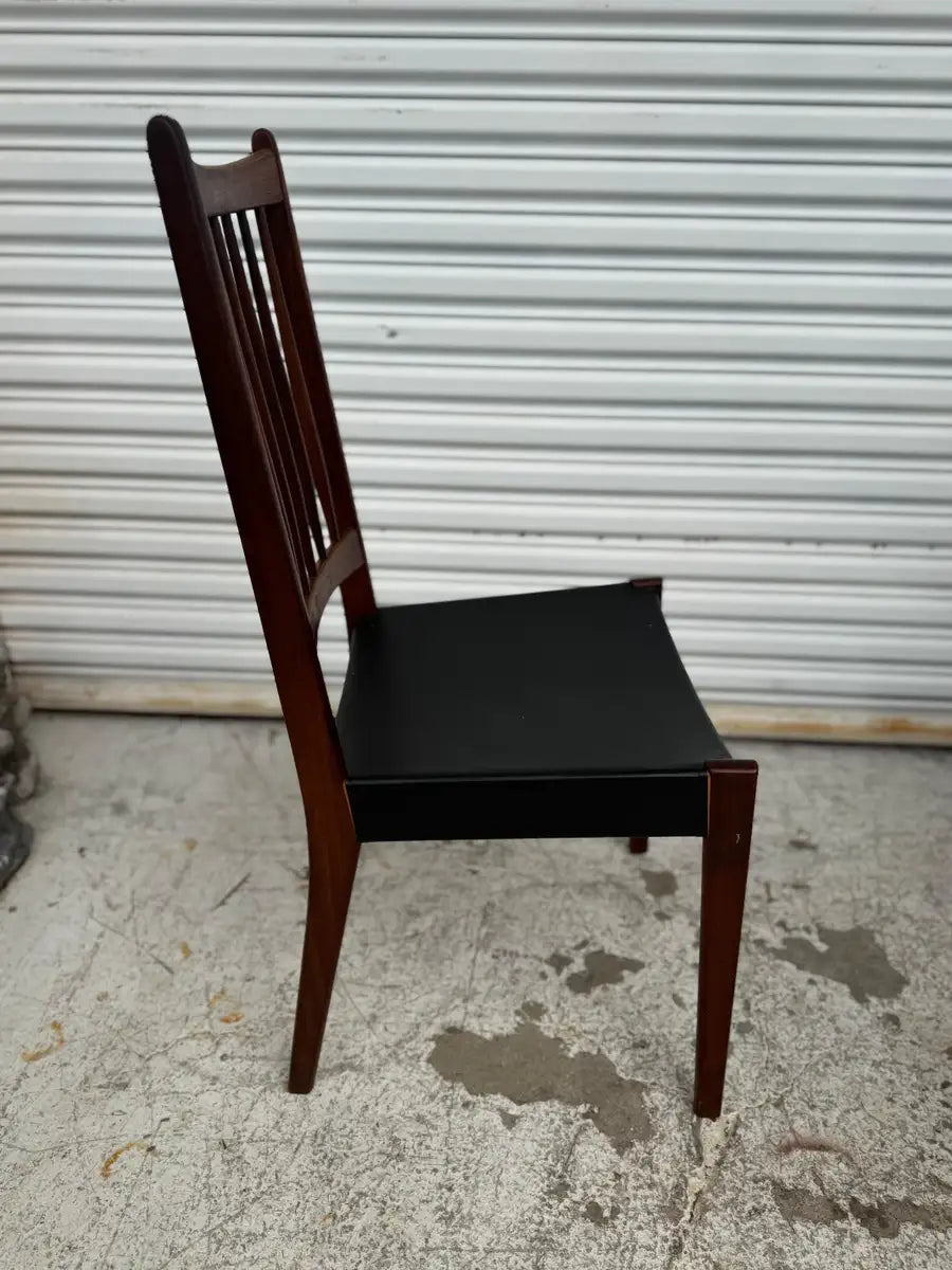 Scandinavian style dining chairs with tapered legs and teak wood
