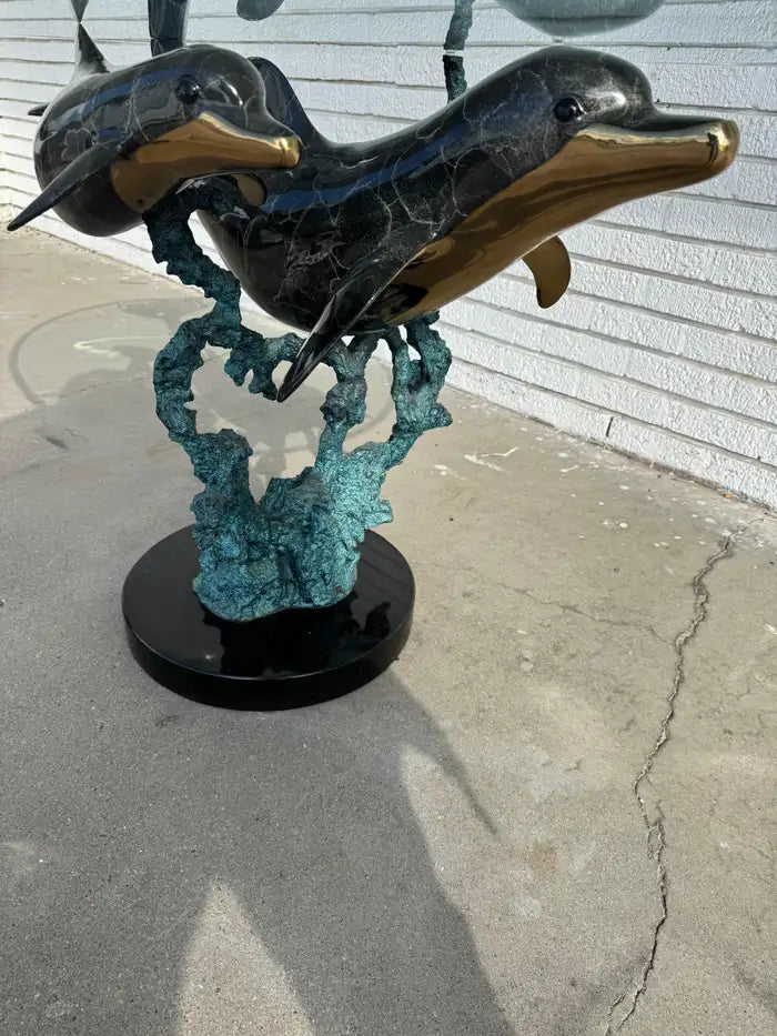 Artistic bronze dolphin table for statement décor