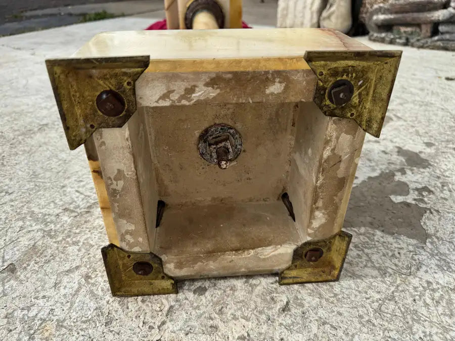carved onyx pedestal with intricate metal detailing