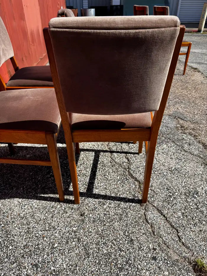 Retro modern teak dining chairs with plush velour seats