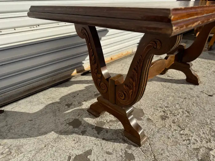 Sculptural walnut coffee table with curved base