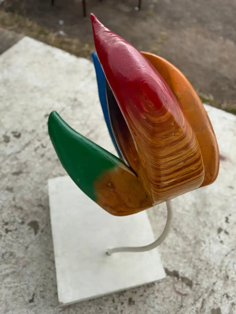 wooden floral sculpture with sculptural curves and stand
