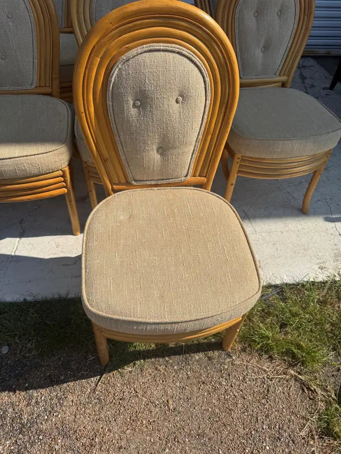 Set of seven vintage rattan dining chairs with woven construction
