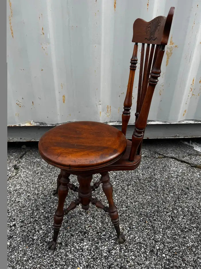 Traditional antique piano stool with marble inset seat and claw feet