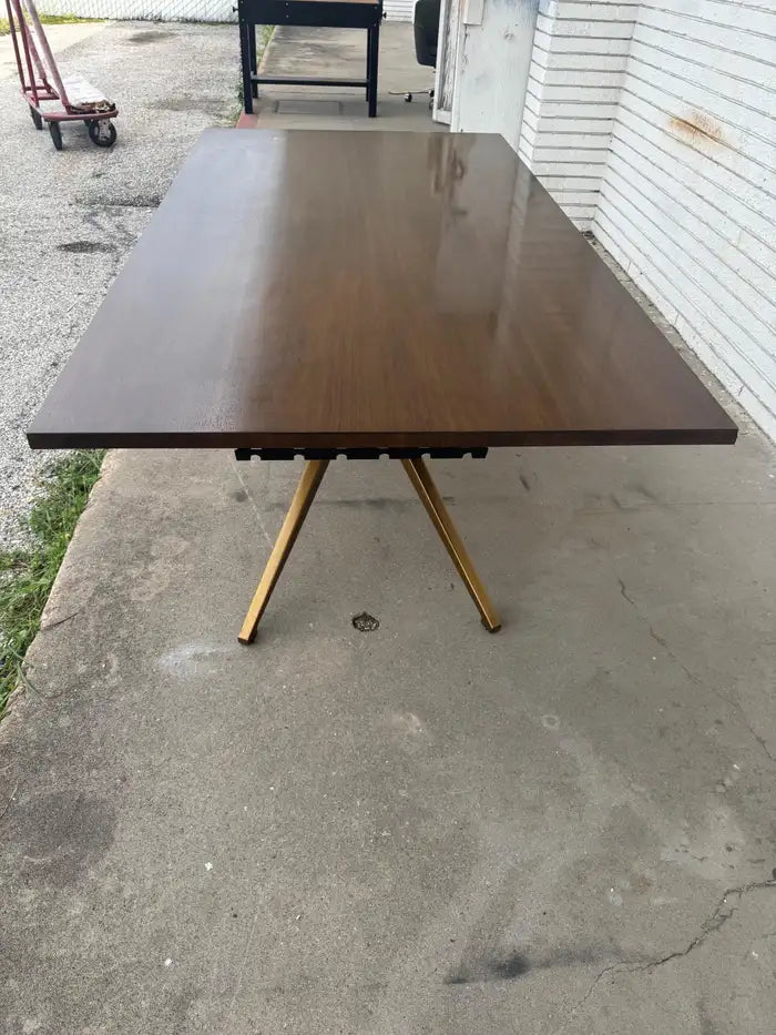 Rectangular walnut dining table with modern wood base