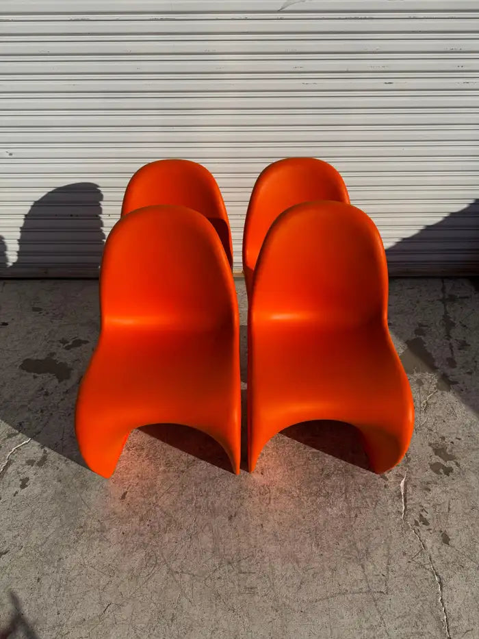 Iconic S shape cantilever dining chairs