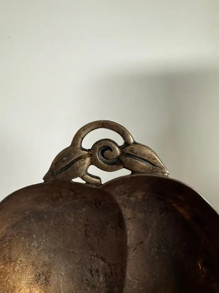 Polished sterling silver nut dish detail