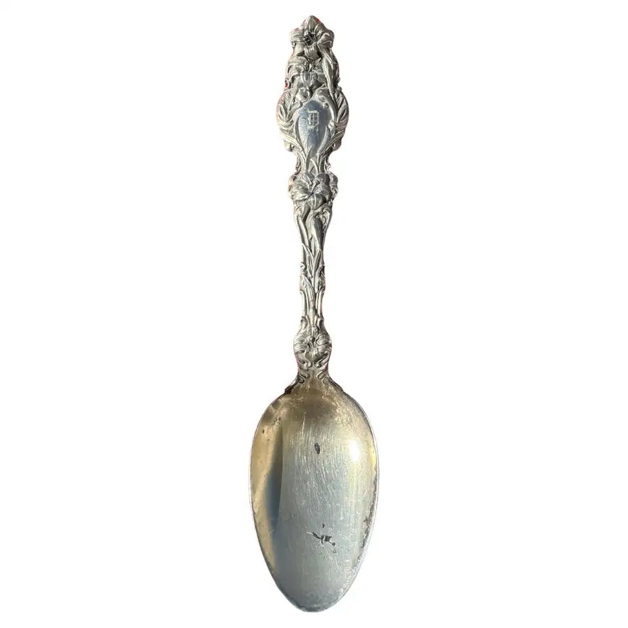 antique sterling silver spoon with engraved handle detail