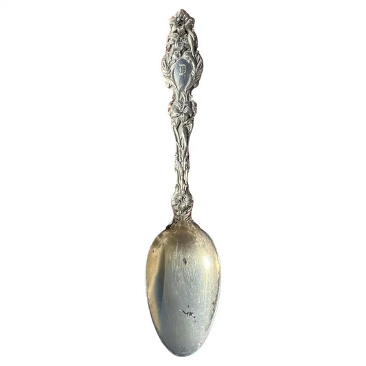 antique sterling silver spoon with engraved handle detail