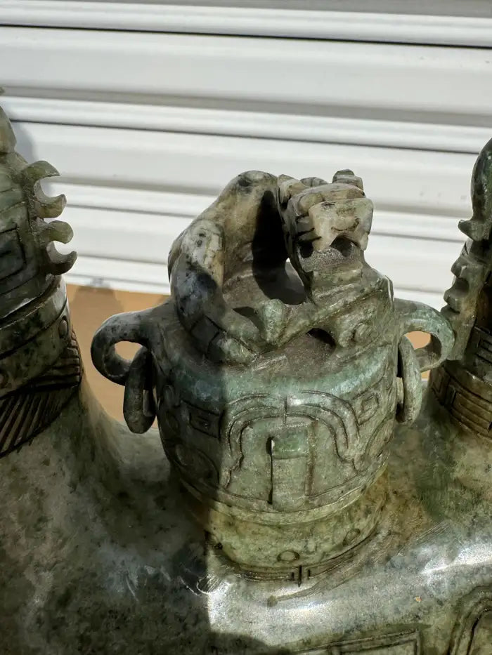 Green jade ram sculpture with detailed horns