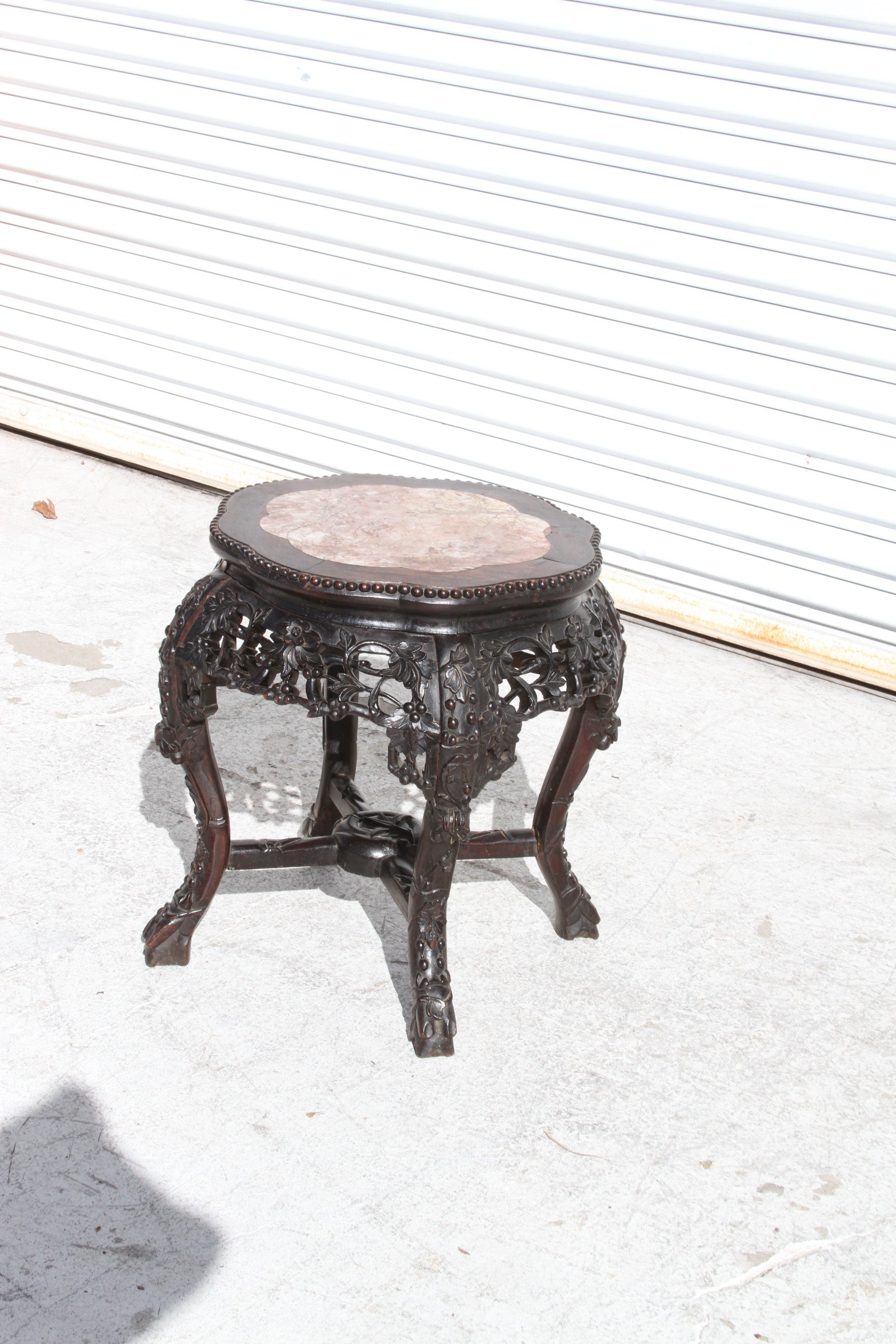 Elevate your interior with this beautiful Chinese hardwood pot stand. Its marble inset top adds a touch of opulence, making it a stunning addition to any room.