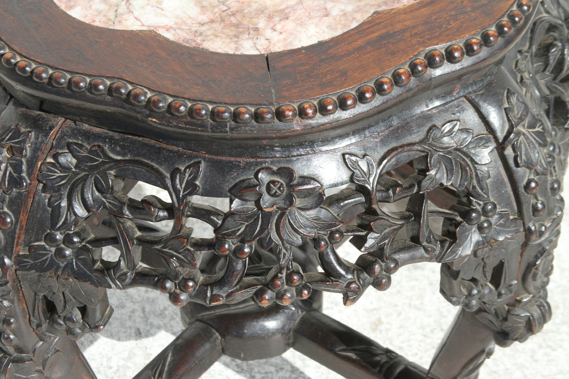 Bring a piece of Chinese artistry into your home with this stunning hardwood pot stand. The marble inset top adds a touch of refinement to this functional piece.