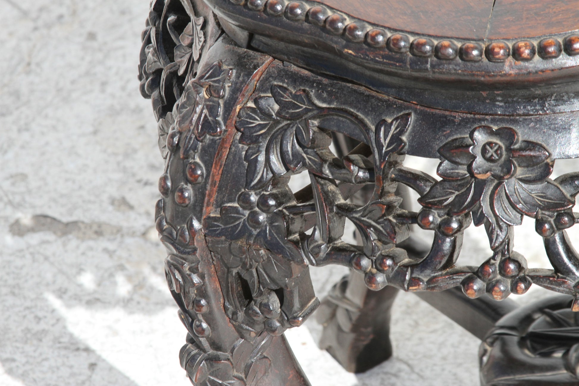 the beauty of Chinese craftsmanship in this hardwood pot stand. Its marble inset top adds a touch of luxury, making it a stunning centerpiece.