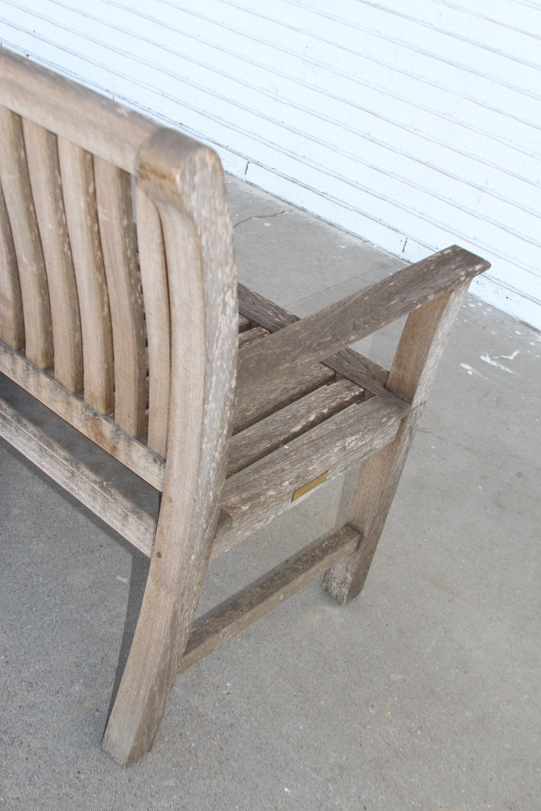 Elevate your outdoor space with the iconic lines and luxurious craftsmanship of the Kingsley Bates Outdoor Bench. A true statement piece for any alfresco setting.
