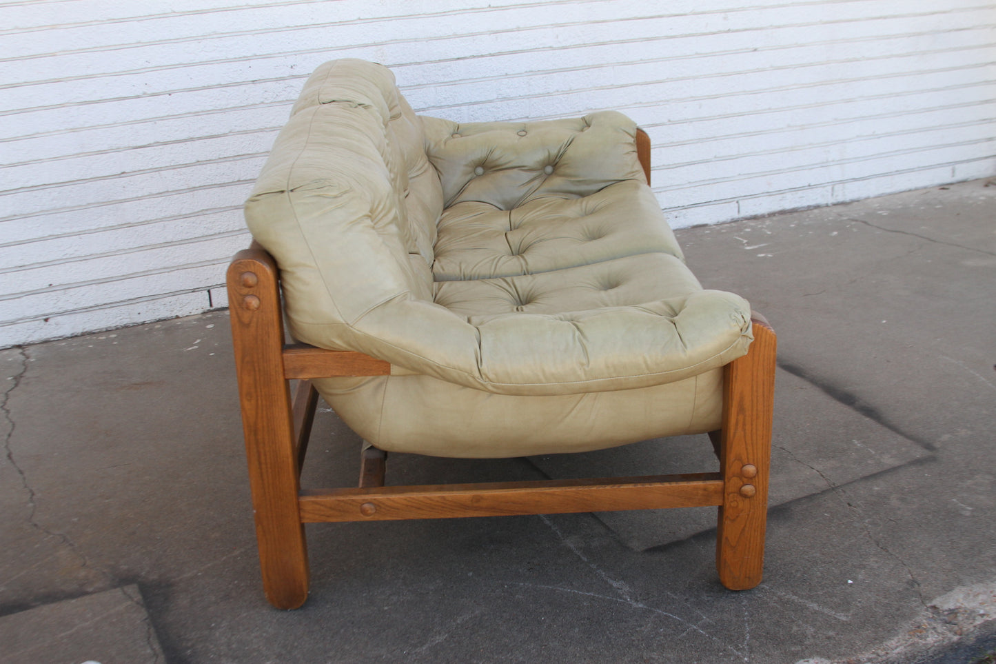 perfect fusion of vintage charm and contemporary elegance with this Mid Century teak loveseat. This love seat sofa is a true investment piece that will elevate your living space.