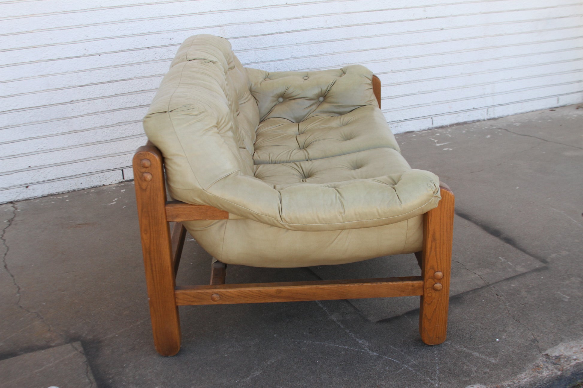 perfect fusion of vintage charm and contemporary elegance with this Mid Century teak loveseat. This love seat sofa is a true investment piece that will elevate your living space.