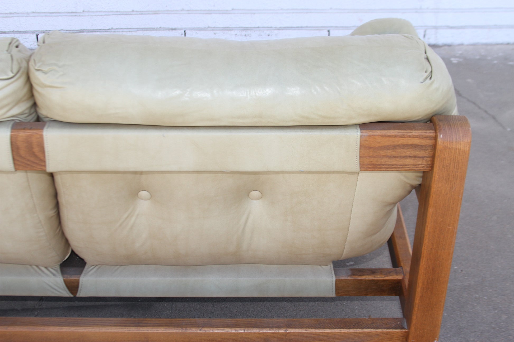 Mid-Century sophistication with this stunning teak loveseat. Crafted with rich, premium materials, this loveseat sofa is a true investment piece.
