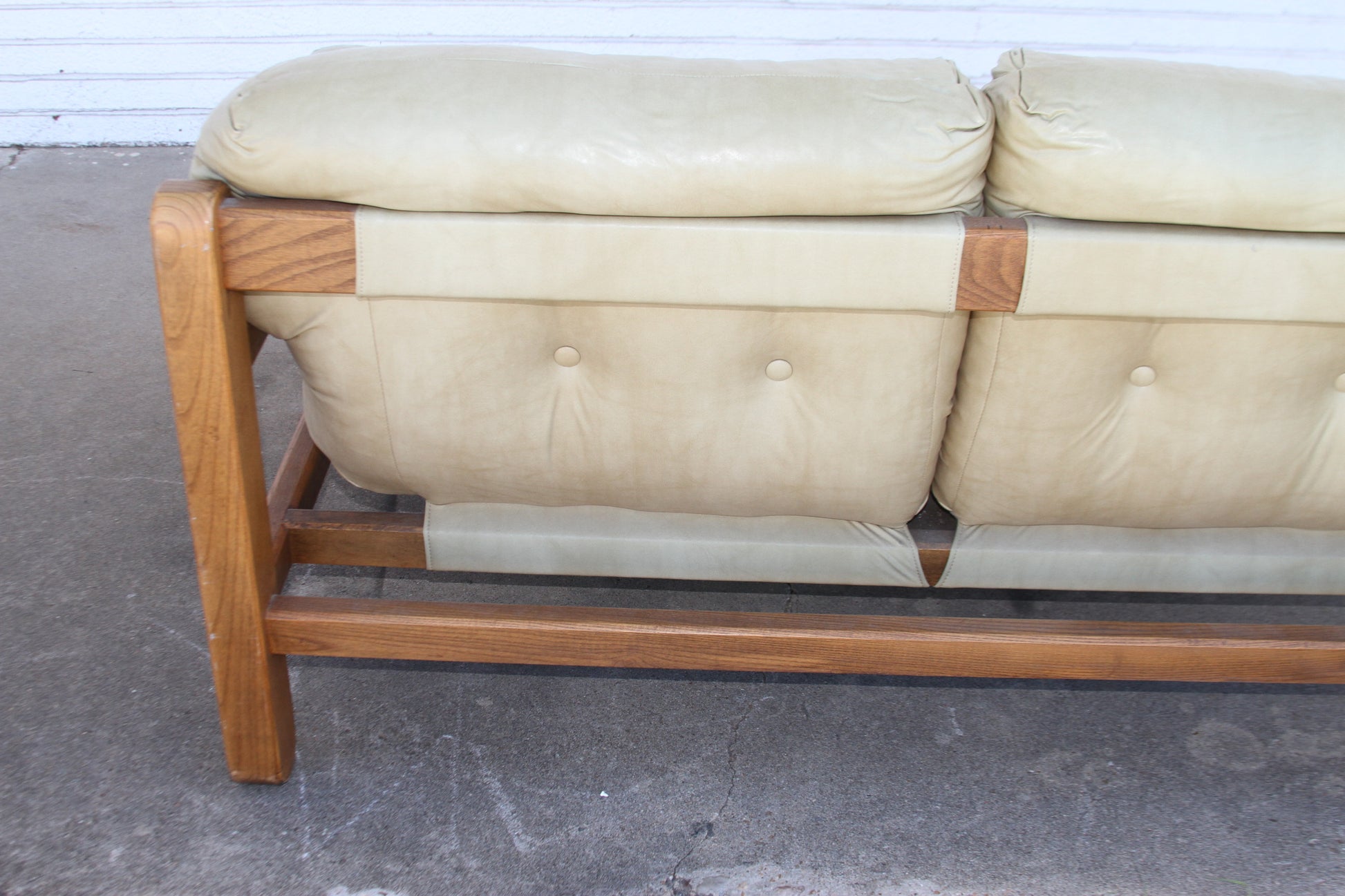 Mid-Century oasis with this exceptional teak loveseat. Its sleek lines and luxurious craftsmanship make this loveseat sofa a true statement piece.