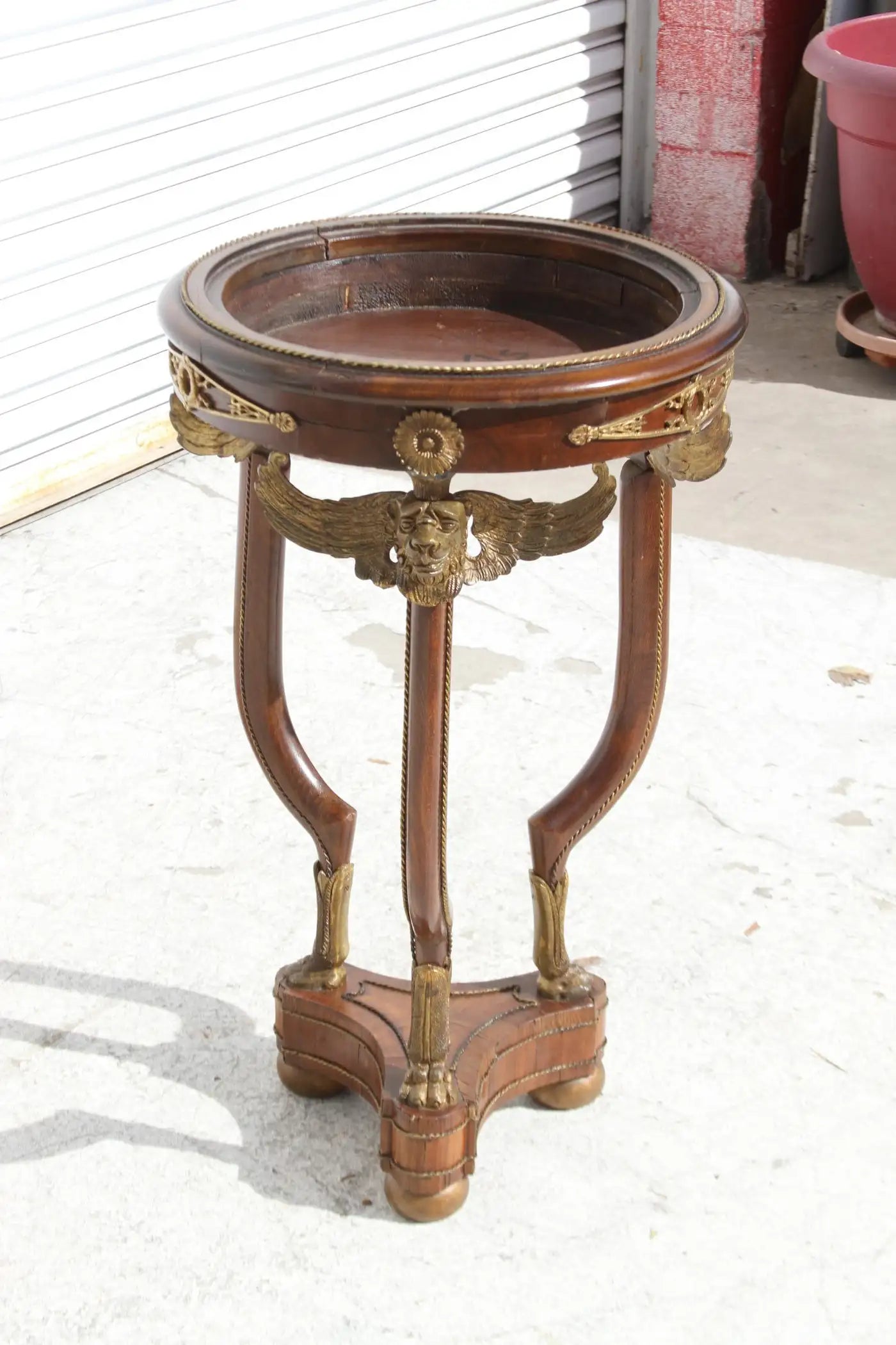 Ornate Art Deco pedestal featuring bronze ormulu