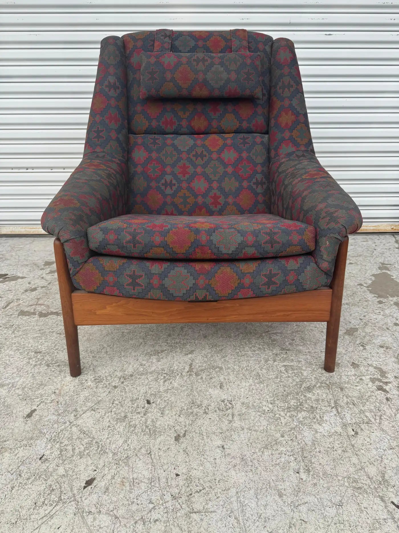 Vintage Scandinavian reclining lounge chair with deep cushioned seat and patterned fabric for statement accent chair décor.
