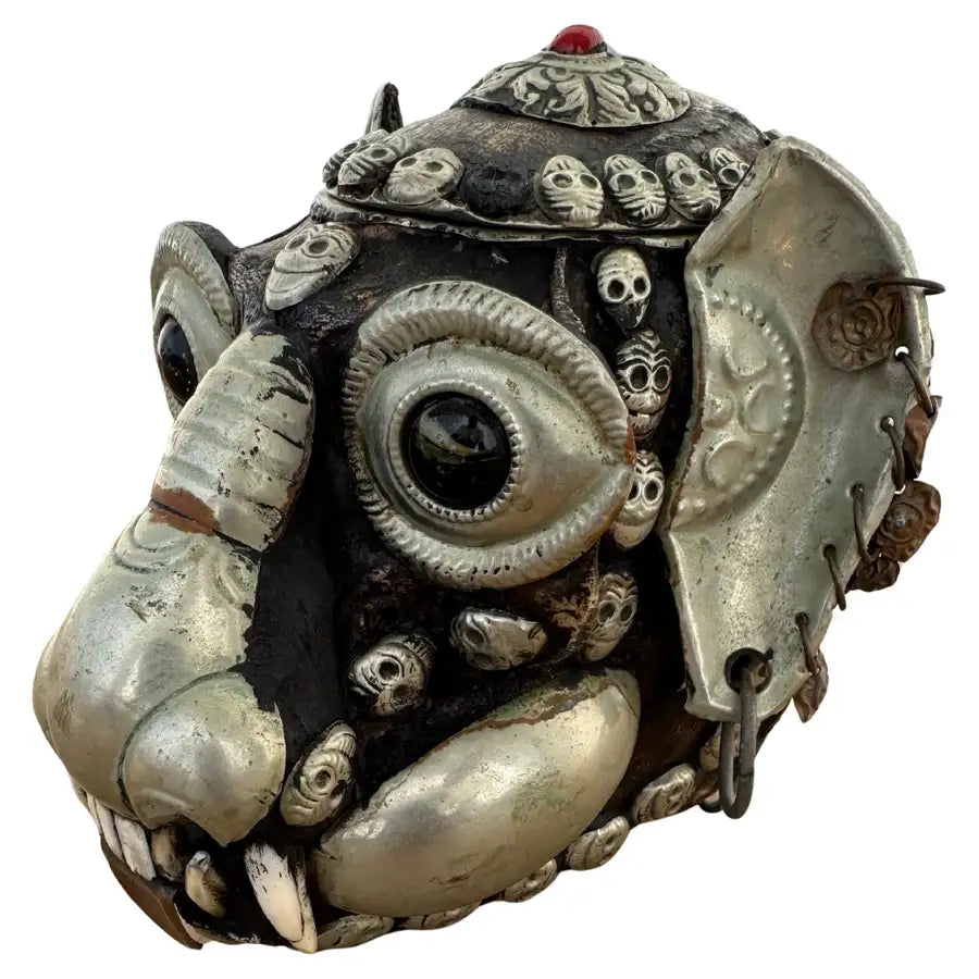Tibetan monkey skull sculpture with metal accents